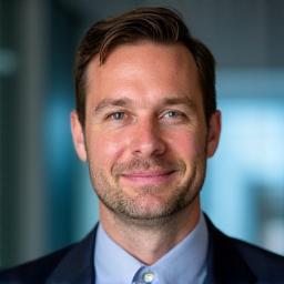 Professional headshot of Ben Carter